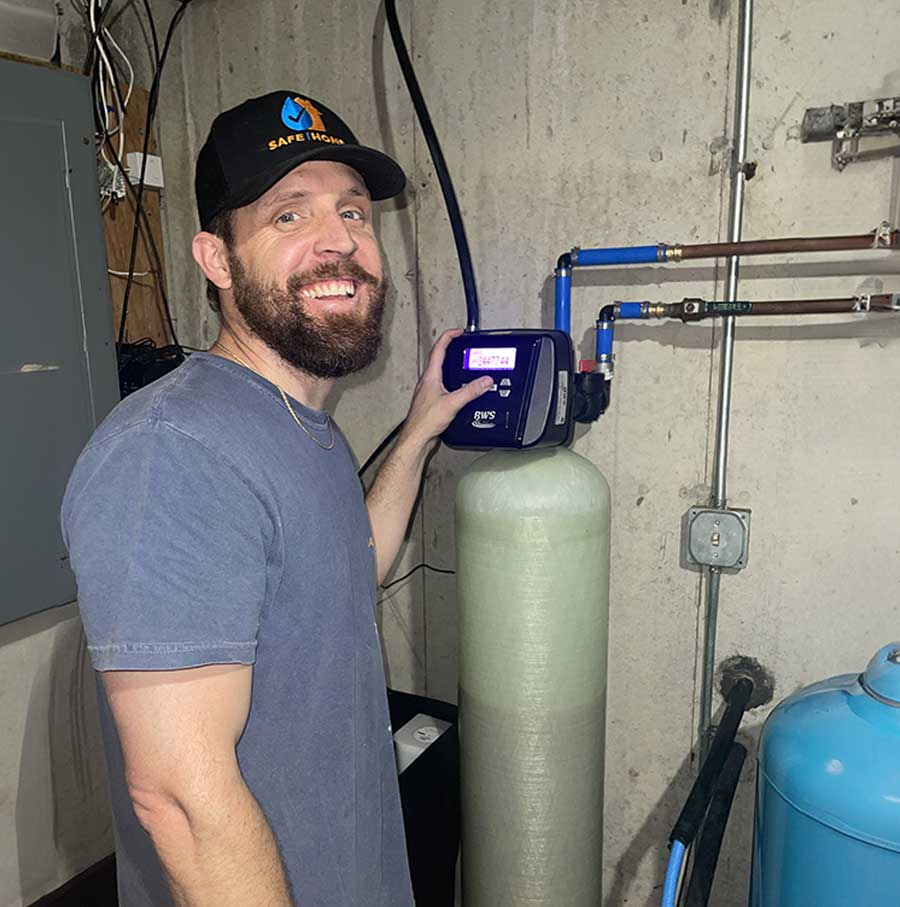 Technician testing water system before recommending solutions